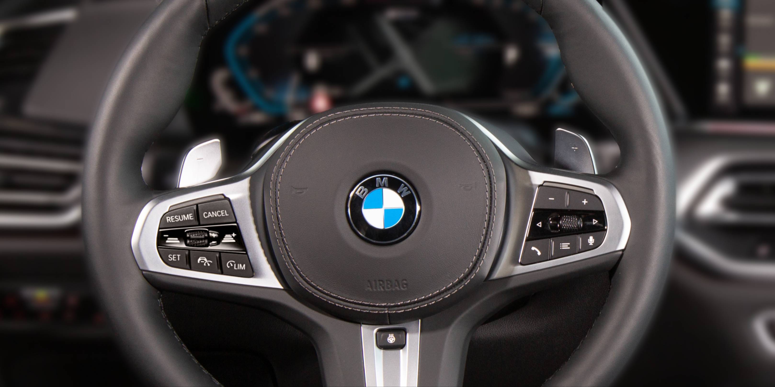 How to turn on the heated steering wheel in a BMW